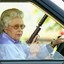 Old Woman With Gun Stock Photo