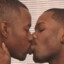 two black gay men kissing